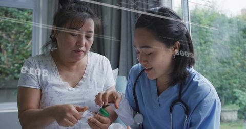 Home Nurse Guiding Patient Opening Green-Cap Medication Bottle Near Window, Compassionate Home Care 