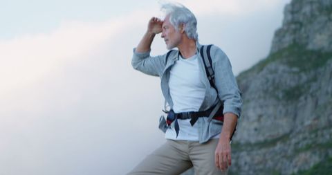 Senior Hiker Experiencing Nature on Mountain Crest - Download Free Stock Images Pikwizard.com