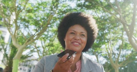 Confident Woman Engaging in Outdoor Voice Recording Call