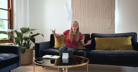Teen Girl Studying on Tablet in Modern Living Room
