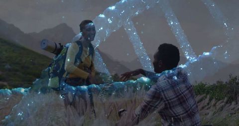 Couple exploring holographic dna in meadow at dawn