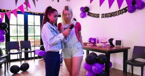 Diverse Friends Taking Selfie at Colorful Birthday Party