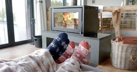 Cozy Winter Relaxation by Fireplace in Warm Socks