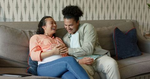 expectant couple planning future together on sofa - Download Free Stock Images Pikwizard.com