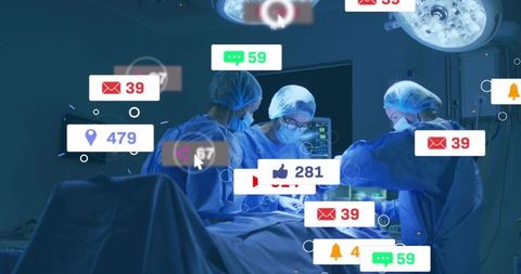 Surgical team performing operation with social media notification overlay and digital data