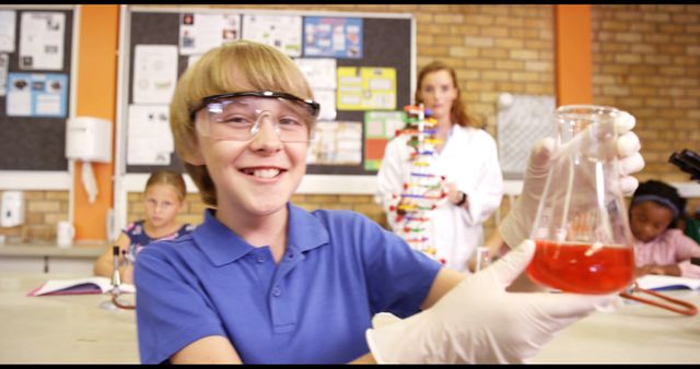 Smiling Boy Holding Beaker During Science Class - Download Free Stock Images Pikwizard.com