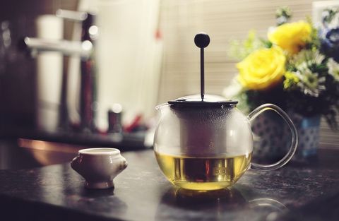 Elegant glass teapot with tea infusing