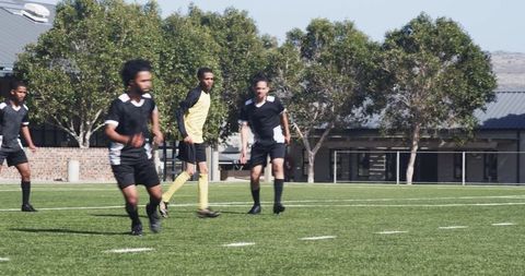 Athletes in Action on Soccer Field During Intense Practice Session
