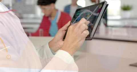 Researcher using tablet for genomics data visualization with interactive charts and dna