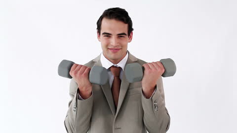 Businessman in Suit Exercises with Dumbbells