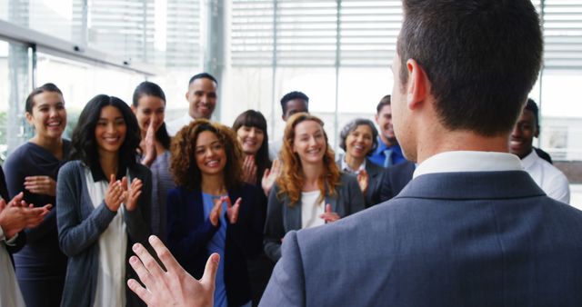 Diverse Business Team Applauding Colleague During Presentation - Download Free Stock Images Pikwizard.com