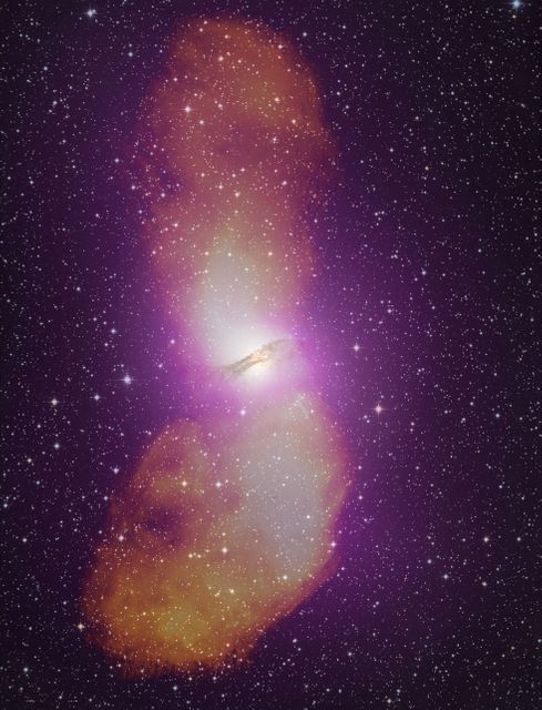 NASA release April 1, 2010  It takes the addition of radio data (orange) to fully appreciate the scale of Cen A's giant radio-emitting lobes, which stretch more than 1.4 million light-years. Gamma-rays from Fermi's Large Area Telescope (purple) and an image of the galaxy in visible light are also included in this composite.   Credit: NASA/DOE/Fermi LAT Collaboration, Capella Observatory, and Ilana Feain, Tim Cornwell, and Ron Ekers (CSIRO/ATNF), R. Morganti (ASTRON), and N. Junkes (MPIfR)  To learn more about these images go to: <a href="http://www.nasa.gov/mission_pages/GLAST/news/smokestack-plumes.html" rel="nofollow">www.nasa.gov/mission_pages/GLAST/news/smokestack-plumes.html</a>  <b><a href="http://www.nasa.gov/centers/goddard/home/index.html" rel="nofollow">NASA Goddard Space Flight Center</a></b>  is home to the nation's largest organization of combined scientists, engineers and technologists that build spacecraft, instruments and new technology to study the Earth, the sun, our solar system, and the universe.