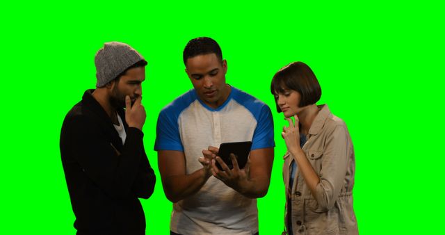 Friends Discussing Ideas While Looking at a Tablet Against Green Screen - Download Free Stock Images Pikwizard.com