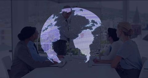 Global strategy team analyzing holographic globe in corporate boardroom