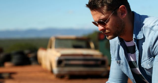 Pensive Man Wearing Sunglasses with Vintage Truck Background - Download Free Stock Images Pikwizard.com