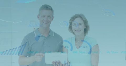 Team analyzing financial data on tablet surrounded by stock market charts