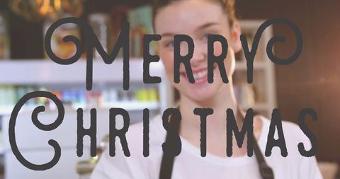 Cheerful Barista Wishing Merry Christmas in Cozy Café