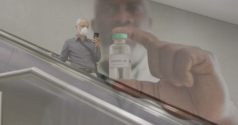 Senior man with facemask and covid-19 vaccine overlay