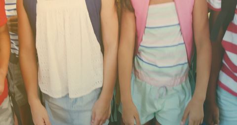 Diverse children's group holding hands in cheerful atmosphere