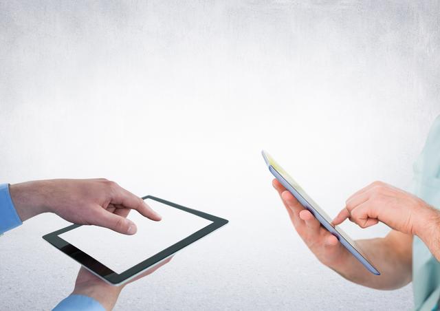 Two People Holding and Using Digital Tablets Against Bright Background - Download Free Stock Photos Pikwizard.com