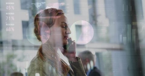 Businesswoman Calling on Smartphone with Data Analytics Overlays in Modern Office Lobby