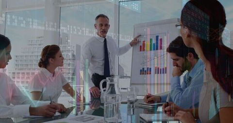 Team meeting with graphical overlay displaying financial data