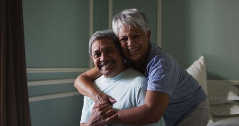 Senior couple relaxing and laughing during isolation