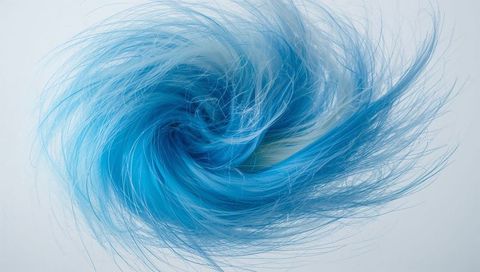 Spiraling Cyan Fiber Vortex Creating Dynamic Blue Swirl with Fine Filaments and Deep Core