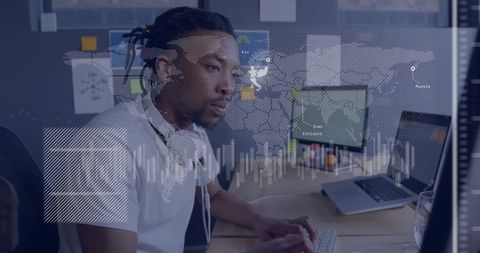 Male Engineer Analyzing Data at Modern Office Desk