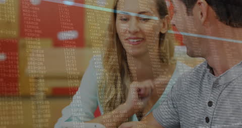 Couple Engaging with Digital Tablet Overlayed with Data Codes
