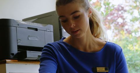 Focused Physiotherapist Treating Patient in Clinic Setting