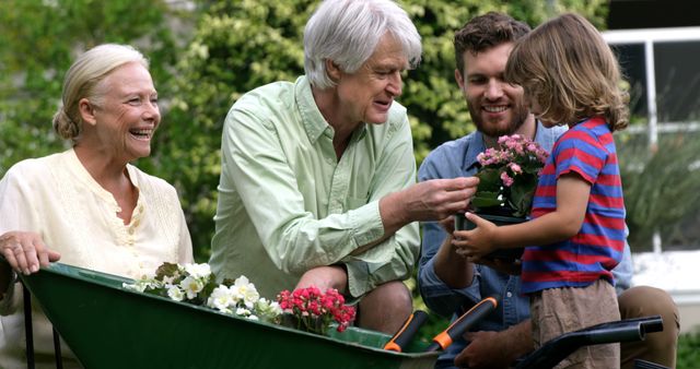 Multigenerational Family Gardening Together Outdoors - Download Free Stock Images Pikwizard.com