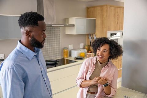 Diverse Couple Enjoying Conversation in Modern Kitchen