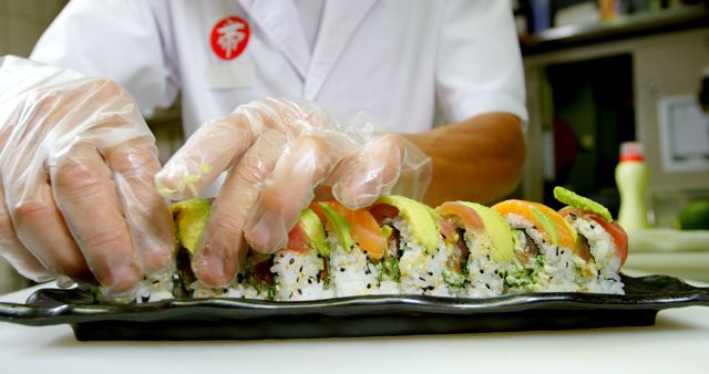 Chef Preparing Fresh Sushi Roll with Avocado and Salmon - Download Free Stock Images Pikwizard.com