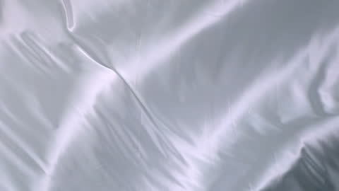 Flowing White Silk Fabric Background with Gentle Waves