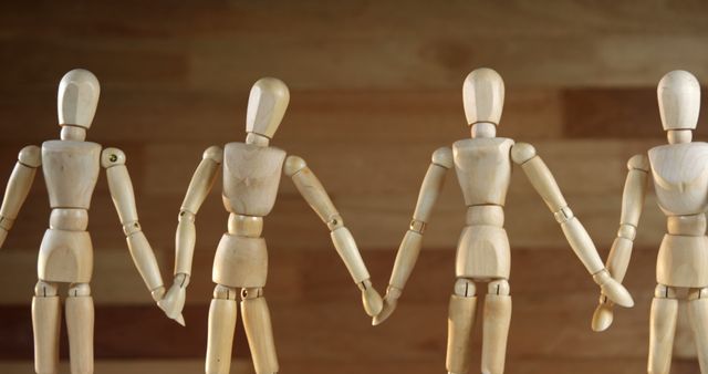 Group of Wooden Mannequins Holding Hands for Unity and Teamwork Concept - Download Free Stock Images Pikwizard.com