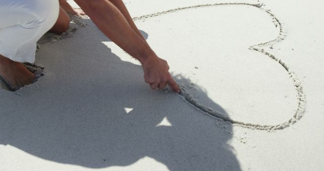 Person Drawing Heart in Sand on Beach - Download Free Stock Images Pikwizard.com