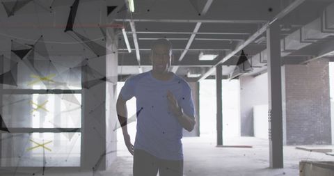 Man Jogging in Abandoned Building with Digital Network Overlay - Download Free Stock Images Pikwizard.com