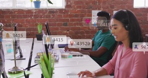 Customer support team collaborating in brick office with headsets and live notifications