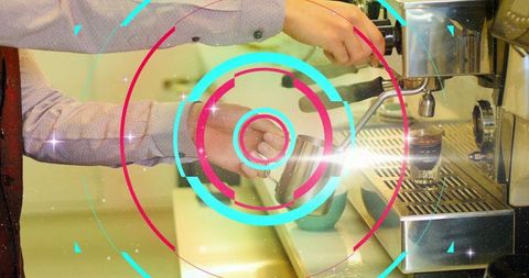 Barista Skillfully Frothing Milk with Latte Art Focus