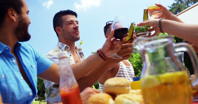 Group of Friends Toasting during Outdoor Summer Picnic - Download Free Stock Images Pikwizard.com