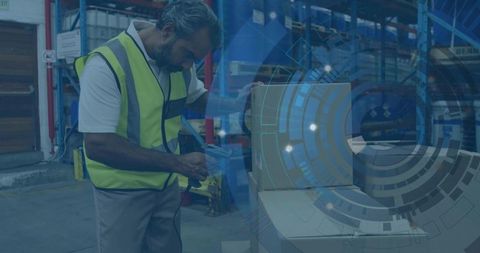 Warehouse worker scanning box with barcode scanner
