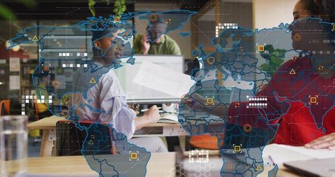 Global team collaborating and reviewing data analytics with interactive world map overlay