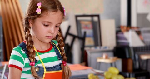 Young Schoolgirl Engaged in Creative Art Class Activity - Download Free Stock Images Pikwizard.com