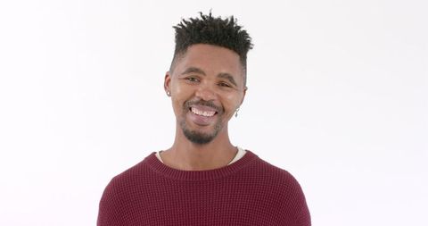 Smiling Man in Casual Sweater Exuding Positivity - Download Free Stock Images Pikwizard.com