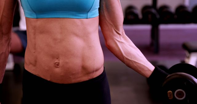 Close-up of Muscular Woman Lifting Dumbbells in Gym - Download Free Stock Images Pikwizard.com