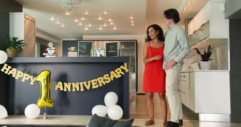 Happy Couple Celebrating One-Year Anniversary in Stylish Living Room