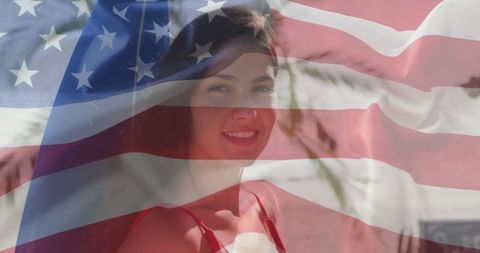 Woman Celebrating Freedom on Beach with Patriotic Spirit