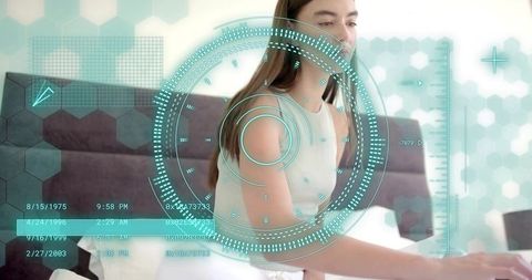 Young woman wearing white sleeveless top using laptop on couch with teal HUD overlay