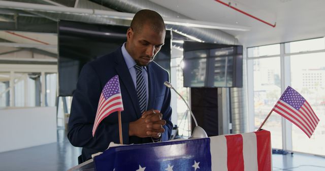African American Man Giving Motivational Speech at Podium with American Flags - Download Free Stock Images Pikwizard.com